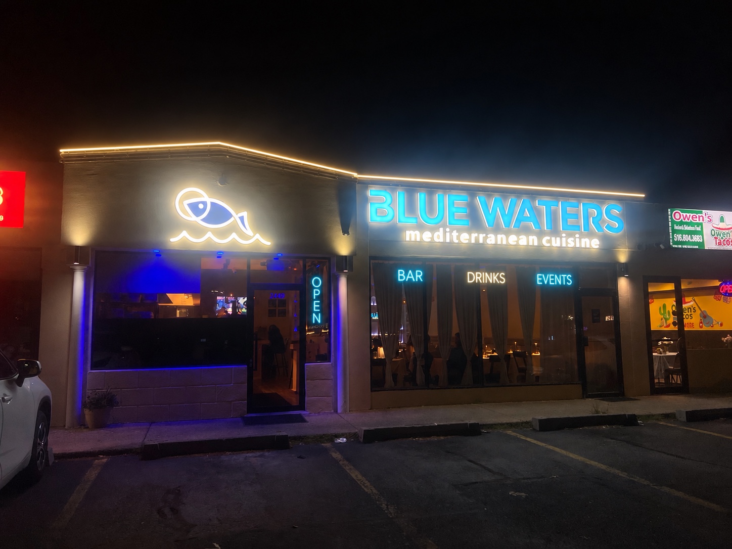 Blue Waters illuminated facade at 2449 Jerusalem Ave